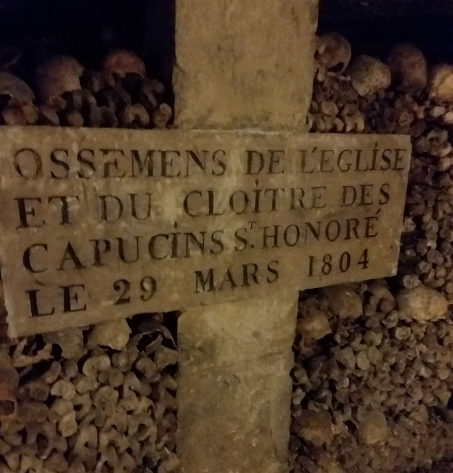 On Rue Faubourg saint Honoré was a Franciscan monastery that was demolished in 1804. From the church cemetery these skeletons were moved down here into this  section of Paris catacombs.