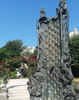 And here is that odd fountain that I mentioned. Saint Julien le Hospitalier lived around 350 CE. According to the legend. His family was a very wealthy, noble family. The father of Julien saw a coven of witches place a curse on his baby when he was born. After Julien was grown he often went hunting and one time while out, he had a vision that he would kill his parents but he dismissed it as nonsense. One time, after he was married, his parents visited his home and his wife brought them to their bedroom where they could sleep. While Julien was out hunting,  a witch came to him and told him that his wife was with a man in their bedroom. Julien rushed back to the house and out of jealous anger, he immediately rushed into the bed room and killed his parents while they were sleeping. After this, on mourning and penitent attitude  he vowed to live a life of good deeds and. He established several hospitals and homes for impoverished families. That is the legend this fountain depicts.
