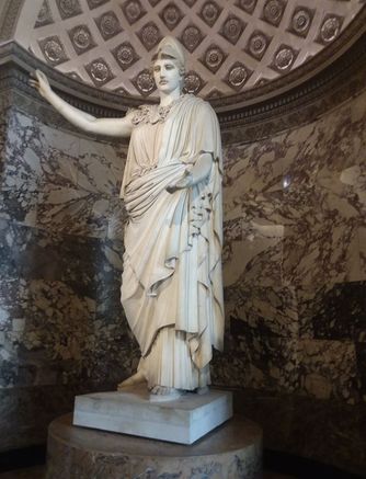 Another sculpture that is displayed in the Louvre Museum. This is a Roman copy of the original Greek sculpture that was made with bronze. This is Athena Velletri and it was discovered in 1797 at the ruins of a Roman villa near Velletri. The Romans created many copies of Athena Velletri but this Louvre Museum example is special because it stands taller than other copies at 10 feet. Athena is a war goddess but she is in her peaceful mode here.