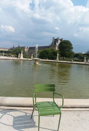 The lovely fountain in the midst of Jardine Tuileries surrounded by the iconic green chairs that are found in several parks of Paris. Jardine Tuileries is more than 500 years old, created as the royal garden of Queen Catherine di Medicis' Palais Tuileries, but it was  opened to the public in 1667. It became a public park of Paris after the French Revolution of 1789.