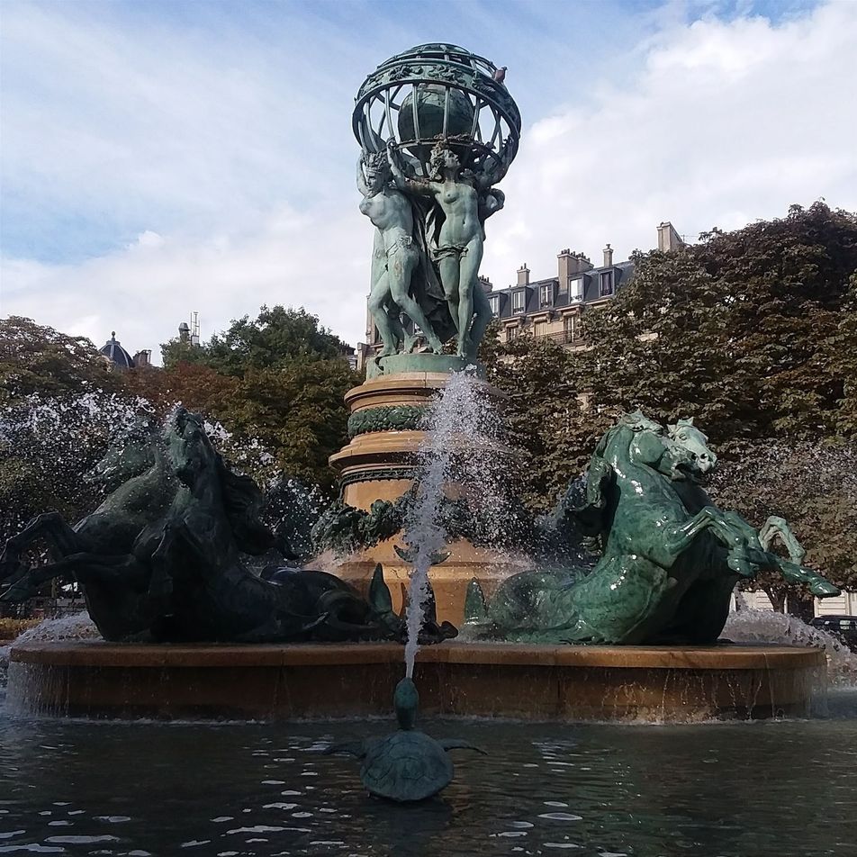 Fontaine de l'Observatorie stands just north of the Marachal Ney sculpture outside of Closerie des Lilas, south of Jardine Luxembourg. It is also called the Four Parts of the World Fountain. It was created by Jean-Baptiste Carpeaux.