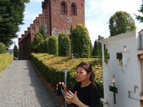 We are outside of Ballerup Kirke having walked up the pedestrian mall then entering at this open gate. There are 3 entrances to the church property that I remember. .