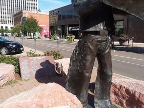 This sculpture is also located in the downtown area of Colorado Springs. Hank represents the Pikes Peak or Bust Rodeo. Behind Hank is a plaque with the names of the Rodeo Hall of Fame cowboys.