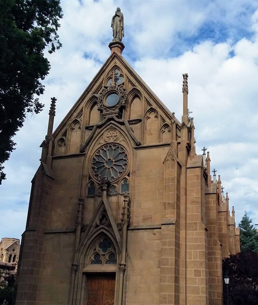 This is Loretto Chapel at 207 Old Santa Fe Trail, Santa Fe New Mexico. Construction began in 1873. The six sisters of Loretto, who were sent to Santa Fe to start up a school for girls had commissioned the construction. There is a 
