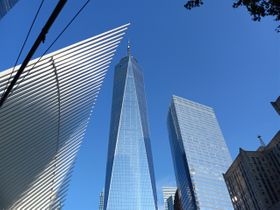 On my video page, I included a video of the NYC skyline while standing between One World Trade Center and 11 Sept. 2001 memorial. Here is a photo I took at the same location. On the left is the Oculus shopping Mall. I believe there is an Eataly location there. The shopping mall is called Oculus Center. It is quite large and underground.
