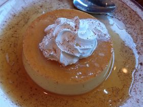 Many New Mexican restaurants will also serve Flan because it is very traditional to Latin American cuisine. It is a custard made with milk, egg, and some kind of sweetener. The sauce on top is a caramel sauce. The milk is usually a condensed milk that may already have the sweetener in it. Cinnamon is also usually sprinkled on it. As you can see here, there is Cinnamon sprinkled all over the flan and the plate.  .