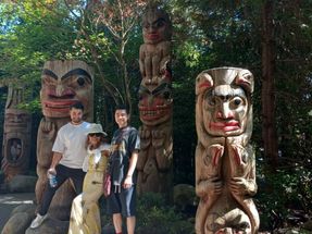 Before we arrived at the Capilano Suspension Bridge, we passed an area that had several totem poles. Here is a photo with my family standing with some of the totem poles.