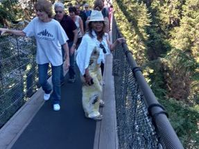 This is called the Capilano Suspension Bridge because it crosses the Capilano River which is 230 feet (70 meters below). It is 460 feet (140 meters) long and has existed here since 1889. As you can see, this is a popular attraction, with something like 1.2 million visitors every year.