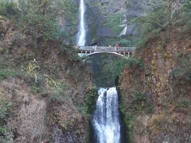 Multnomah Falls is the tallest waterfall in Oregon. As can be seen, it falls 620 feet in two sections with a bridge between the sections. It is also one of the tallest waterfalls in the USA that runs all year. It is in the Columbia River Gorge.  Just take highway 84 east from Portland Oregon through Troutdale and the road signs will clearly lead the way.